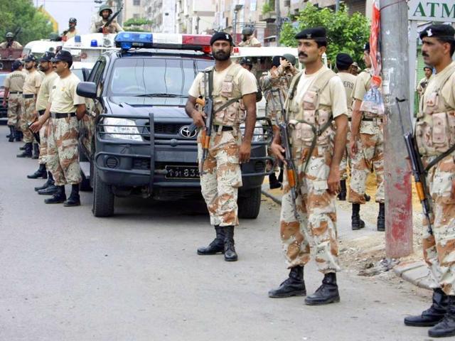 Pakistani security personnel visit a troubled area during a crackdown operation against target killers and the extortion mafia in Karachi.