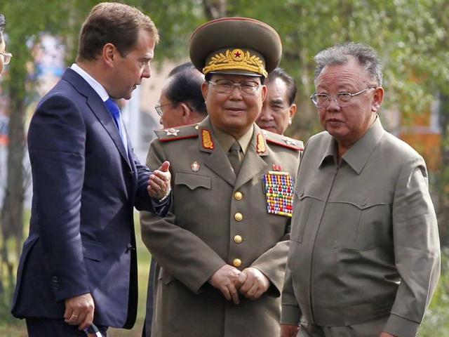 Russia's President Dmitry Medvedev shows the way to North Korean leader Kim Jong-il during their meeting at the "Sosnovyi Bor" military garrison in Siberia's Buryatia region.