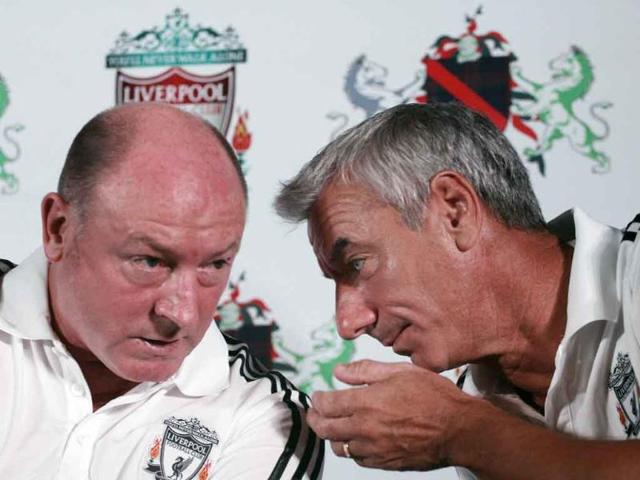 Former Liverpool striker Ian Rush (R) speaks with former England and Liverpool midfielder Steve McMahon during the launch ceremony of the club's first soccer academy in India.