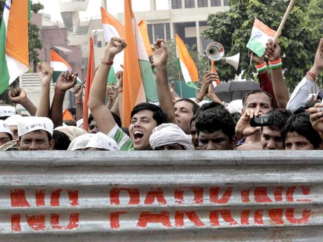 Supporters shout slogans as anti-corruption activist Anna Hazare, unseen, sits on the 10th day of his hunger strike in New Delhi.