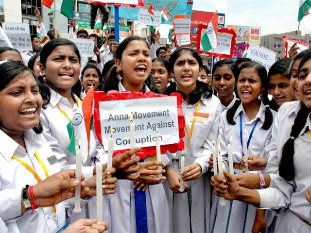 School children take part in a candle light vigil in support of social activist Anna Hazare’s movement against corruption in Ranchi.