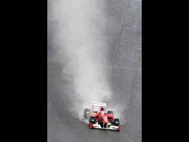 Ferrari driver Fernando Alonso of Spain steers his car during the first practice session, ahead of the Belgian Formula One Grand Prix in Spa-Francorchamps, Belgium.