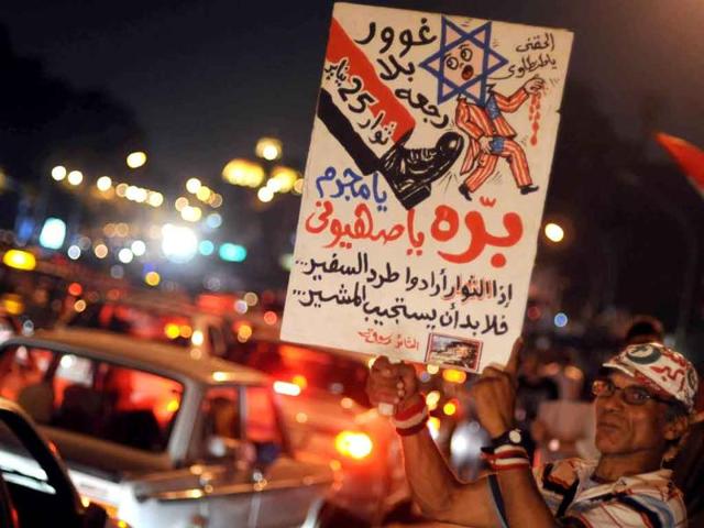 Egyptian protesters gather outside the Israeli embassy in Cairo, demanding the ambassador's expulsion, after five Egyptian policemen were killed along the border with Israel last week.