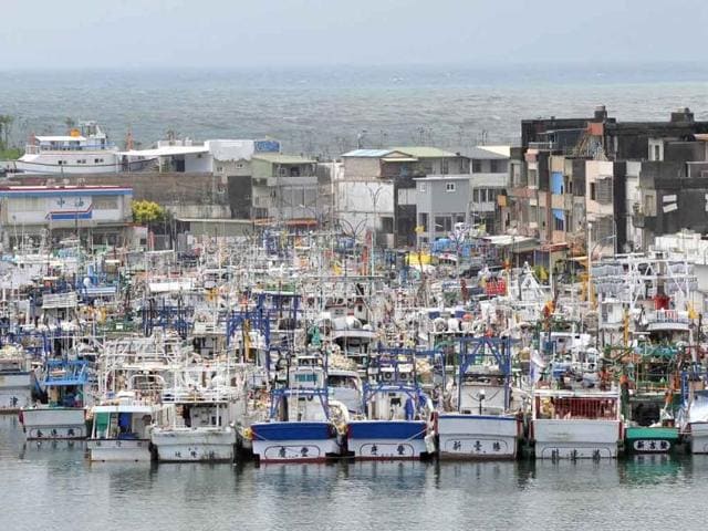 Hundreds of fishing boats pack the port of Nanfangao, a major fishing village in Taiwan's northeastern Ilan county. Typhoon Nanmadol, saying the storm which had left at least seven people dead or missing in the Philippines may trigger torrential rains and strong winds.