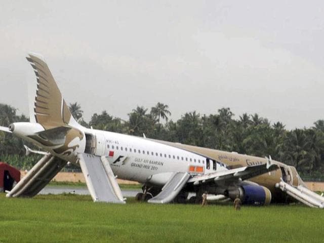 A Gulf Air passenger planes lies on the ground after it skidded off the runway at Kochi International Airport in Kochi.