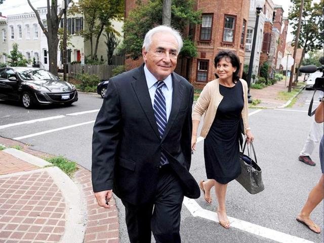 Dominique Strauss-Kahn and his wife Anne Sinclair return to their residence in Georgetown after paying a visit to the IMF headquarters in Washington.