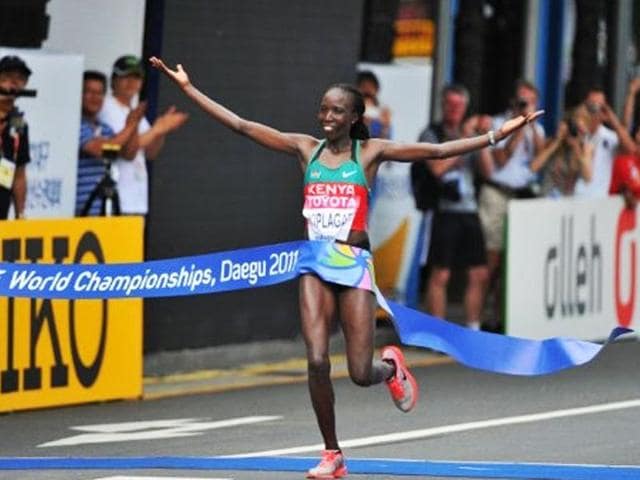 Edna Kiplagat of Kenya celebrates after winning the women's marathon event at the International Association of Athletics Federations (IAAF) World Championships in Daegu.