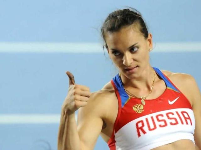 Russia's Elena Isinbaeva gives a thumbs-up as she competes in the women's pole vault final at the IAAF World Championships.
