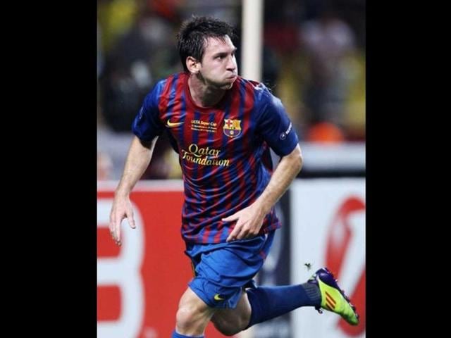 Barcelona's Argentinian midfielder Lionel Messi spits after scoring a goal during the UEFA Super Cup football match FC Barcelona vs FC Porto at the Louis II stadium in Monaco.