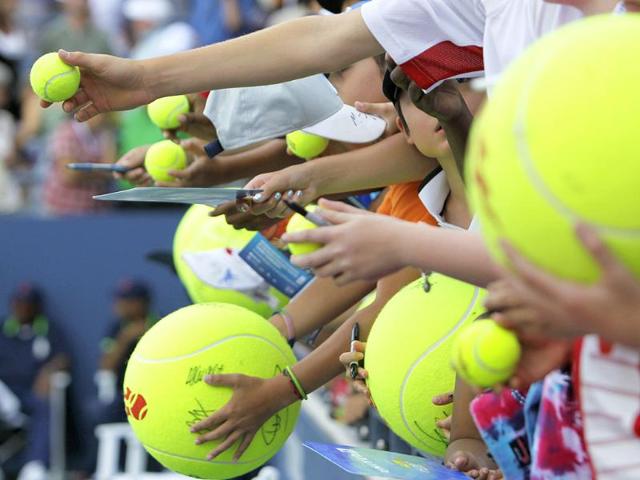 Fans wait for an autograph from Christine McHale after a match against Marion Bartoli of France during the US Open tennis tournament in New York.