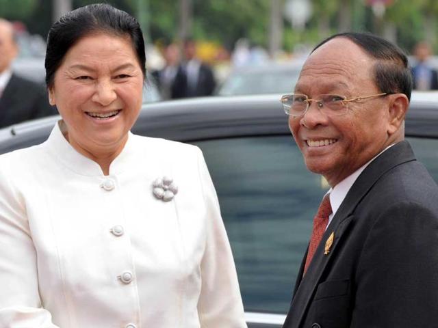 President of the Cambodian National Assembly and Honorary president of the Cambodian People's Party (CPP) Heng Samrin (R) and President of the Laos National Assembly Pany Yathotu (L) smile upon her arrival at the National Assembly building in Phnom Penh. Pany is here for a four-day official visit.