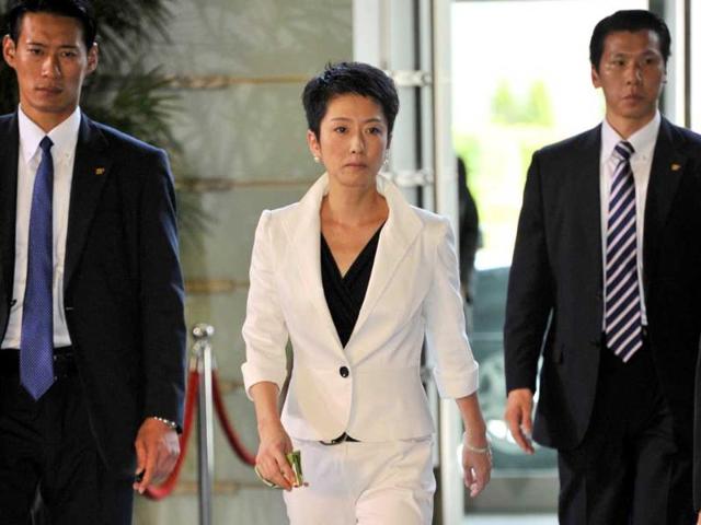 Newly appointed Government Revitalization Minister Renho (C) enters the prime minister's official residence in Tokyo. Japan's new Prime Minister Yoshihiko Noda named a cabinet with which he hopes to drive a fragile post-earthquake recovery forward and build party unity.