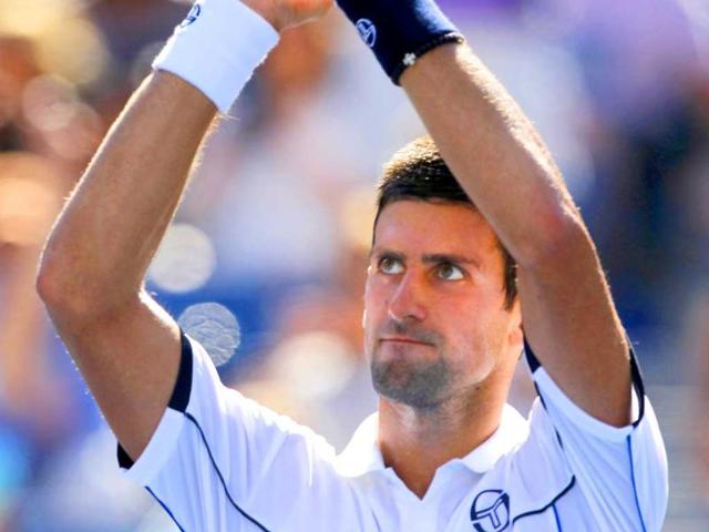 Novak Djokovic gestures to the crowd after his match with Conor Niland of Ireland in the first round of the US Open tennis tournament in New York.