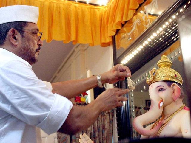 Bollywood actor Nana Patekar decorates an idol of Lord Ganesha for installation at their residence, on the occasion of Ganesh Utsav in Mumbai. (PTI)
