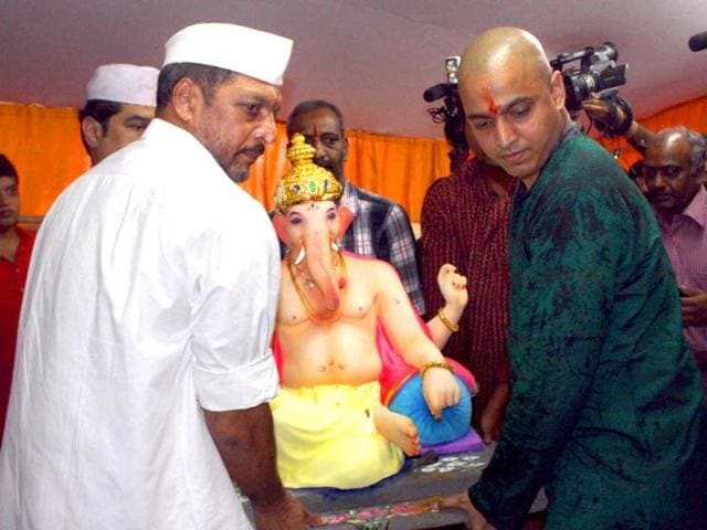 Nana Patekar with his son carrying an idol of Lord Ganesha for installation at their residence, on the occasion of Ganesh Utsav in Mumbai. (PTI)