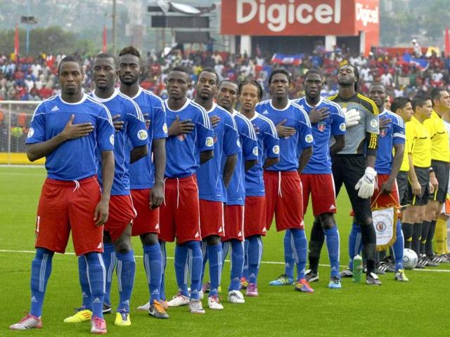 Haiti's national soccer players stand during the playing of their national anthem in Port-au-Prince, ahead of a Concacaf second round qualifier against the US Virgin Islands for the 2014 World Cup finals in Brazil.
