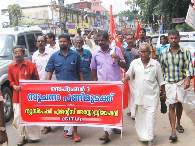 Newspaper agents taking out a march to the Collectorate as part of the statewide agitation in support of their demands including revision of Commission in Kottyam, Kerala.