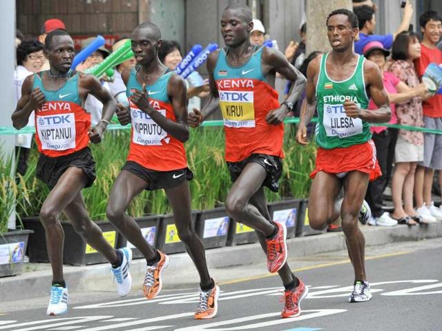 Abel Kirui of Kenya (2R) leads the field from Feyisa Lilesa of Ethiopia (R), Eliud Kiptanui of Kenya (L) and Vincent Kipruto of Kenya (2L) during the men's marathon at the International Association of Athletics Federations (IAAF) World Championships in Daegu. Abel Kirui of Kenya won in 2:07:38 to take the gold medal.