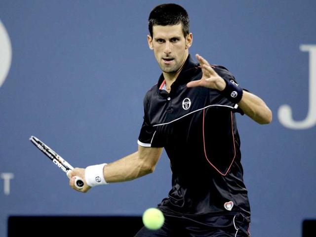 Novak Djokovic of Serbia returns a shot to Nikolay Davydenko of Russia during Day Six of the 2011 US Open at the USTA Billie Jean King National Tennis Center in the Flushing neighborhood of the Queens borough of New York City.