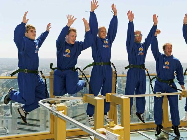 Australian Wallabies Rugby World Cup winger James O'Connor (L) joins World Rally Championship drivers Jari-Matti Latvala (2nd-L), Mikko Hirvonen (3rd-L), Sebastian Loeb (3rd-R), Petter Solberg (2nd-R) and Mathew Wilson (R) as they jump up and down on an observation deck of the Sydney Tower Skywalk . Round 10 of the FIA World Rally Championship will be held on the New South Wales Coffs Coast on September 8-11.