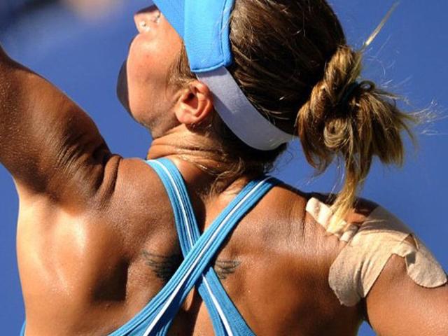 Kateryna Bondarenko from Ukraine plays a shot against Vera Zvonareva from Russia during their Women's US Open 2011 match at the USTA Billie Jean King National Tennis Center in New York.