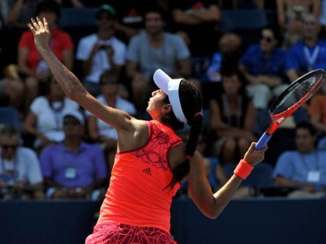 Christina McHale of the US returns a shot to number eight seed Marion Bartoli of France during a Women's single match at the US Open tennis tournament.