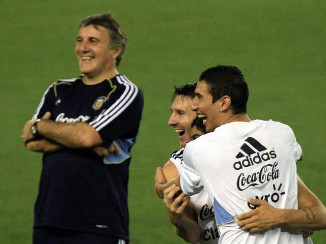 Argentine captain Lionel Messi (C) shares a light moment with teammates during a practice session in Kolkata.