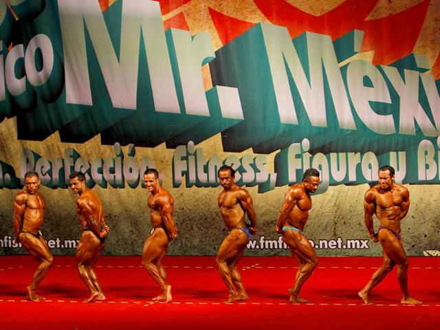 Men compete during the Mr Mexico bodybuilding contest in Mexico City