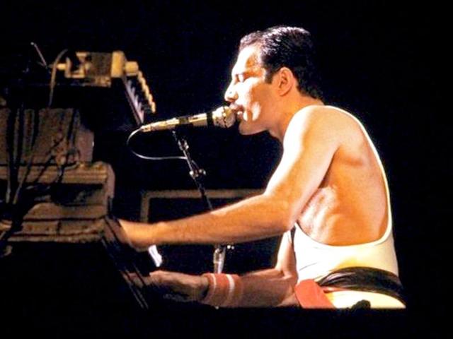 A file picture showing Rock star Freddie Mercury, lead singer of the rock group Queen, during a concert at the Palais Omnisports de Paris Bercy (POPB). Today is his 65th birthday anniversary.