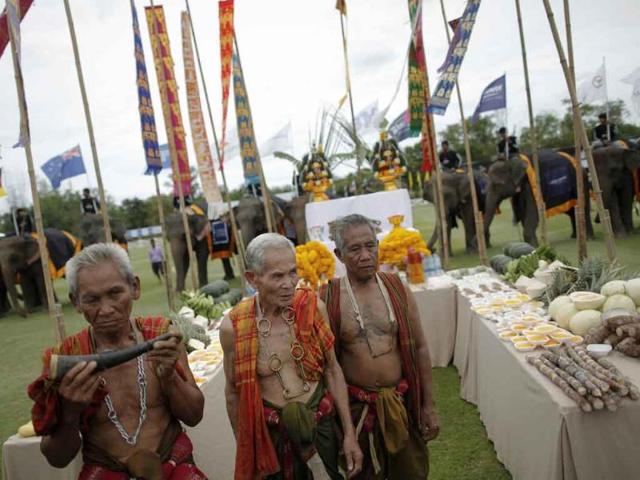 Three Khru Ba Yai, or elephant spirit men, attend the opening parade of the 10th annual King's Cup Elephant Polo Tournament in Hua Hin.