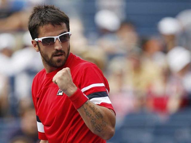 Janko Tipsarevic of Serbia celebrates a point against Juan Carlos Ferrero of Spain during their match at the US Open tennis tournament in New York.