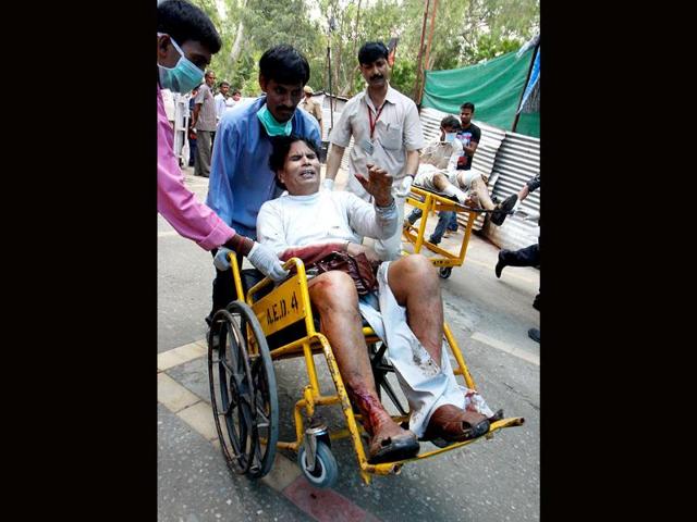An injured person arrives at RML Hospital after a powerful bomb blast outside Delhi high court.