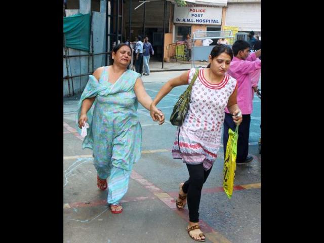 Relatives rushing to the RML Hospital after a powerful bomb blast outside Delhi high court, in New Delhi.