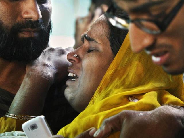 Relatives of victims of Delhi high court bomb blast at RML Hospital in New Delhi.