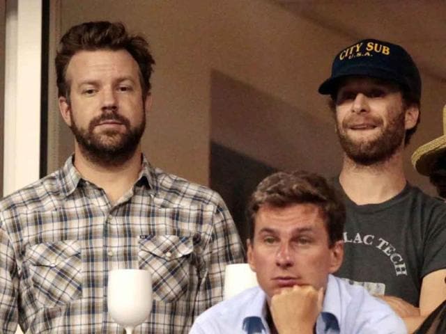 Actor Jason Sudeikis (L) watches play between Caroline Wozniacki of Denmark and Svetlana Kuznetsova of Russia during Day Eight of the 2011 US Open at the USTA Billie Jean King National Tennis Center.