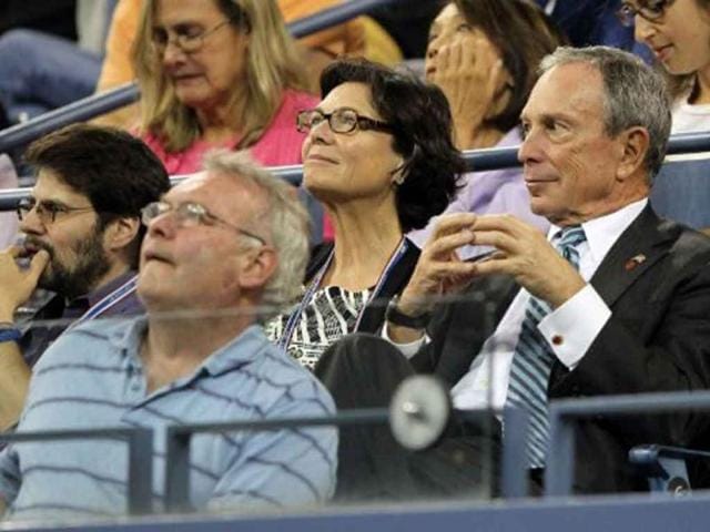 New York City mayor Michael Bloomberg watches Roger Federer of Switzerland play against Santiago Giraldo of Colombia during a 2011 US Open match.