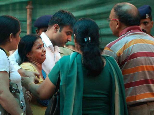 Relatives of a high court blast victim at the RML hospital in New Delhi.