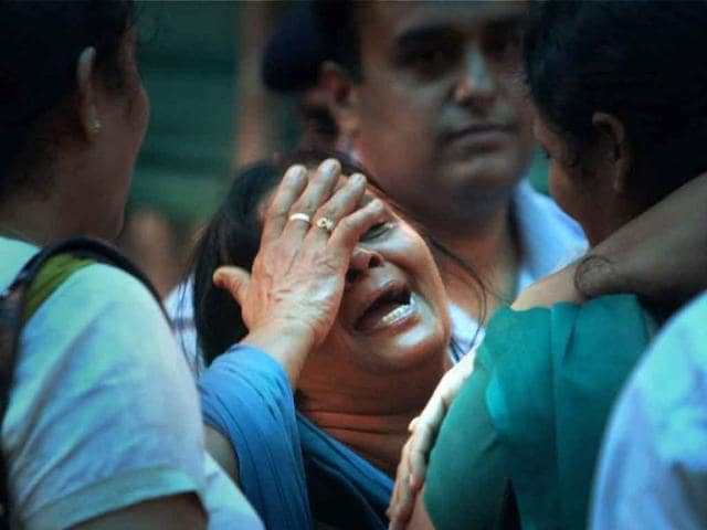 A relative of a high court blast victim wails at the RML hospital in New Delhi.