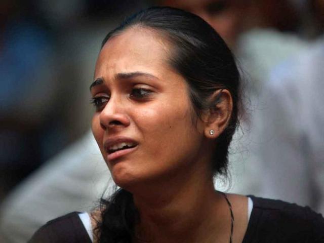A relative of a high court blast victim wails at the RML hospital in New Delhi.