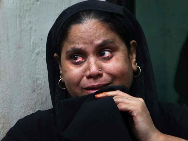 Mumtaz whose father Nizamuddin was killed in a bomb explosion at the high court, waits for the release of his body at the RML hospital in New Delhi.