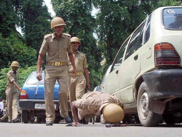 Security personnel checking vehicles outside Lucknow bench of Allahabad High court after the bomb blast in Delhi high court premises.