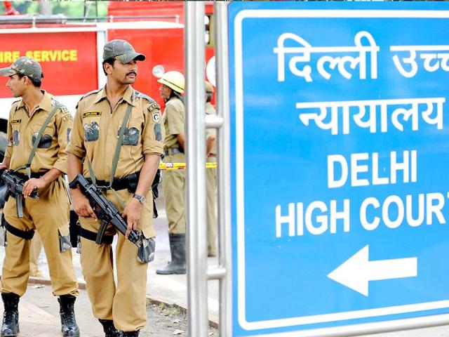 Police commandos stand guard in front of Delhi high court in New Delhi.