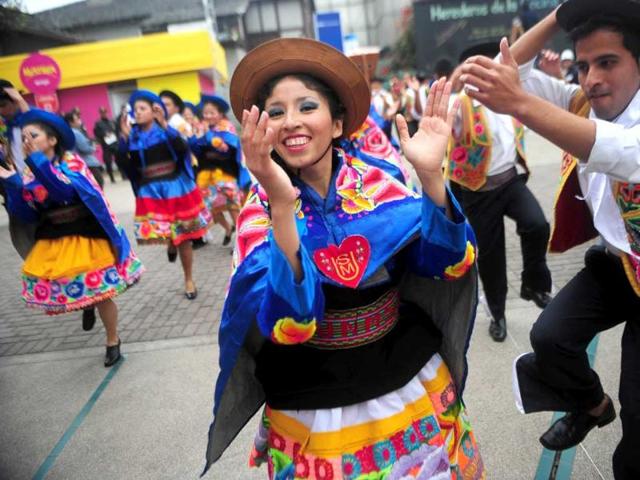 Dancers perform during the inauguration of the gastronomic fair 'Mistura' in Lima.