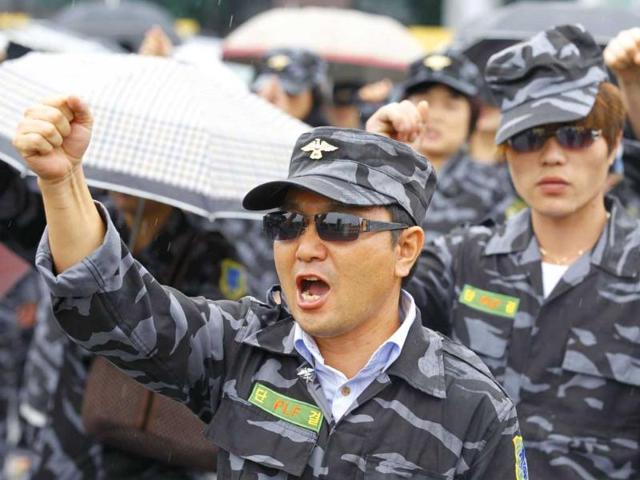 Members of the North Korean People's Liberation Front, which consists of former soldiers in the North's People's Army who defected and are now living in the South, chant anti-North Korea slogans near the demilitarized zone separating the two Koreas in Paju, north of Seoul.