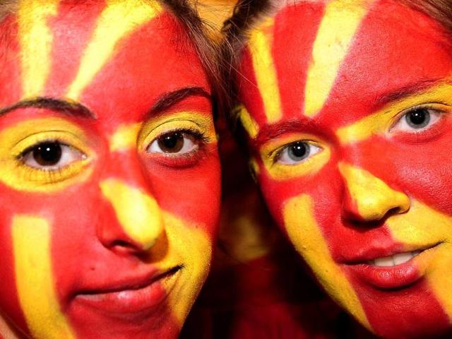 Revelers, with faces painted with Macedonian flag colours, celebrate 20 years of independence in Skopje.