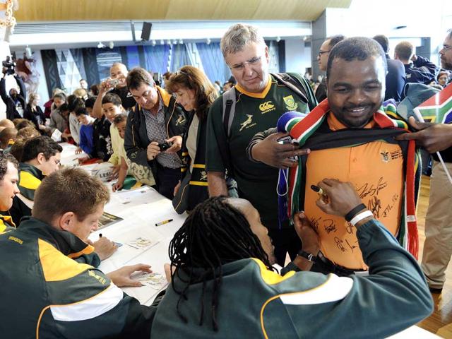 Supporters of the South African Rugby team queue to get autographs from the Springbok's team.