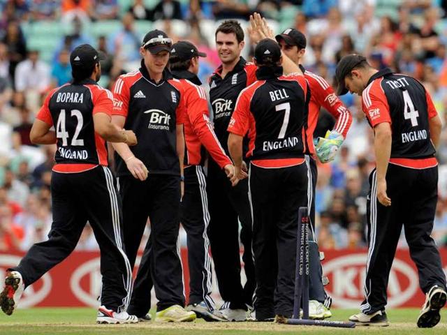 James Anderson (4th L) is congratulated after dismissing Parthiv Patel during the third one-day international cricket match at the Oval cricket ground in London.