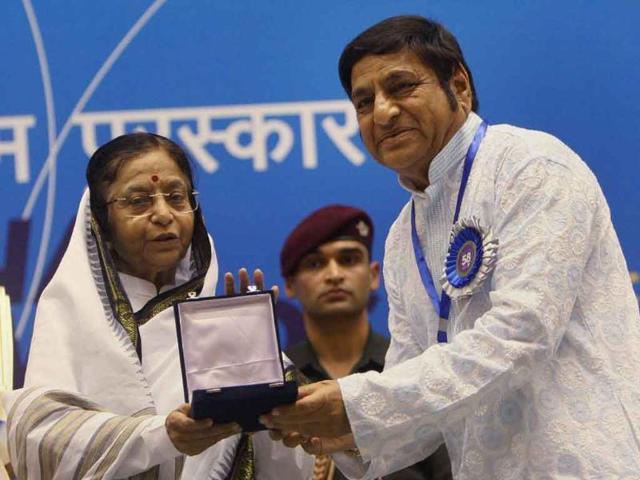 President Pratibha Patil presents Best Children's Film Award to filmmaker Basantkumar Patil for his film Hejjegalu during the 58th National Film Awards Function in New Delhi.