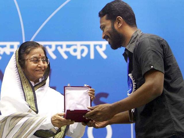 President Pratibha Patil presents Best Direction award to Vetri Maaran for his film Aadukalam during the 58th National Film Awards Function in New Delhi.