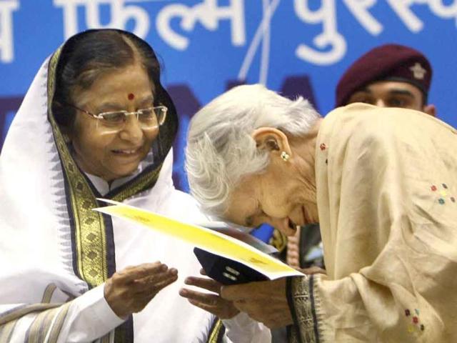 President Pratibha Patil presents the Best Book on Cinema award to Vijaya Mulay for her book From Rajahs and Yogis to Gandhi and Beyond during the 58th National Film Awards Function in New Delhi.